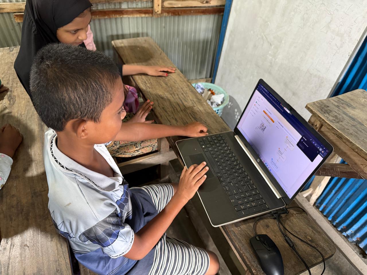 A student exploring a brainstorm screen on a laptop
