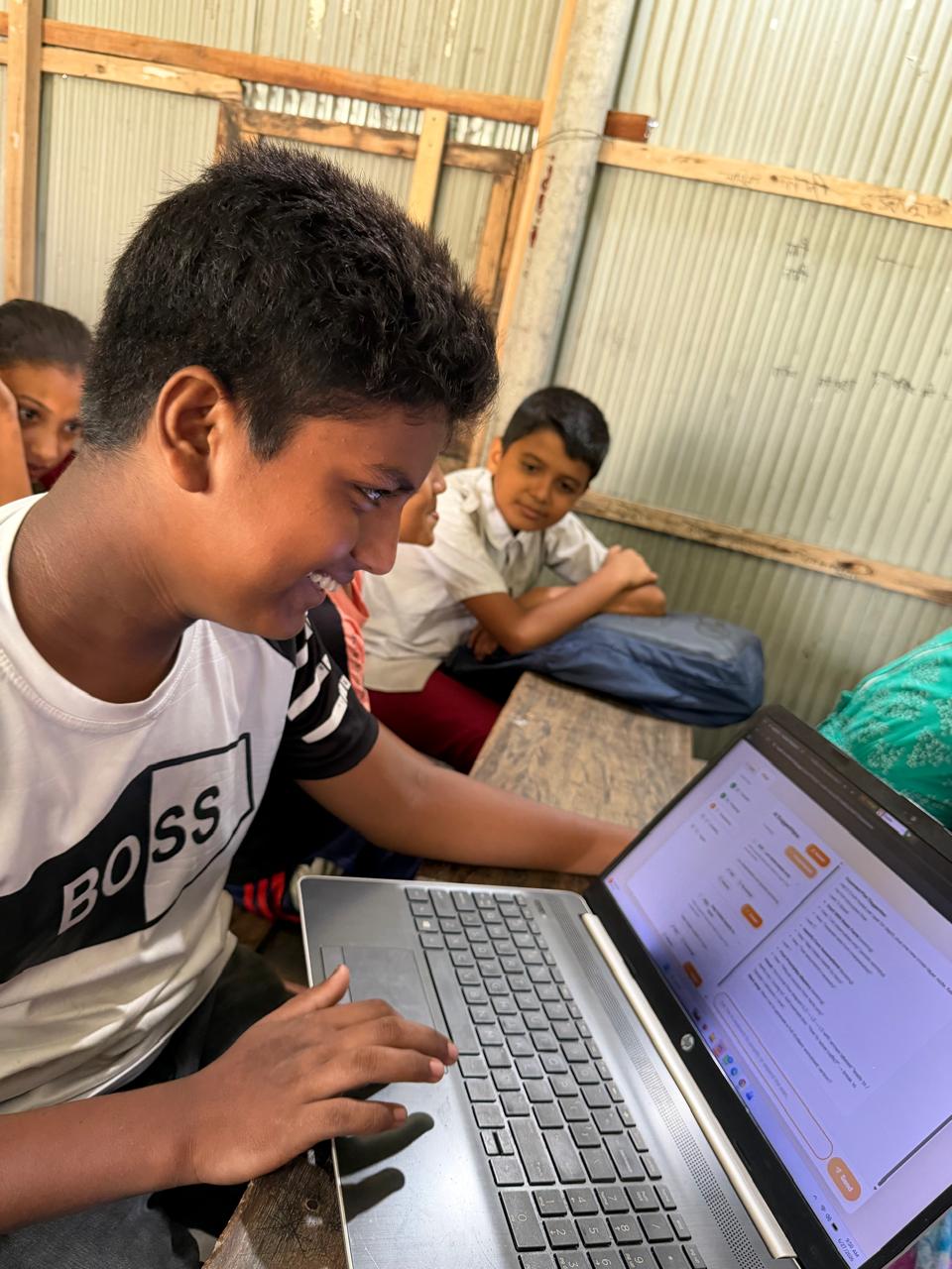 A student smiling while working through a lesson